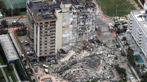 An aerial view showing a partially collapsed building in Surfside near Miami Beach, Florida, U.S., June 24, 2021. - Sputnik International