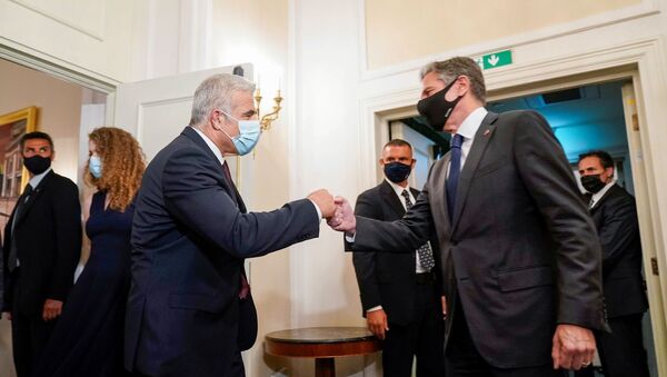 U.S. Secretary of State Antony Blinken greets Israeli Foreign Minister Yair Lapid during their meeting in Rome, Italy, June 27, 2021. - Sputnik International