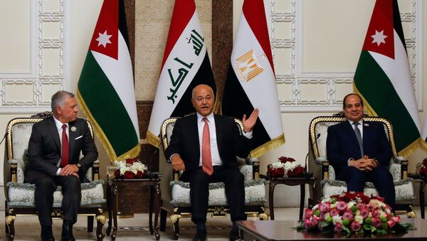 Iraqi President Barham Salih meets with King Abdullah II of Jordan and Egypt's President Abdel Fattah al-Sisi, in Baghdad, Iraq, June 27, 2021. - Sputnik International