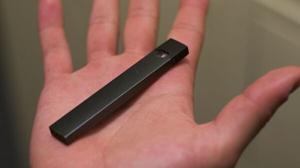 An electronic cigarette manufactured by Juul Labs, Inc.  - Sputnik International