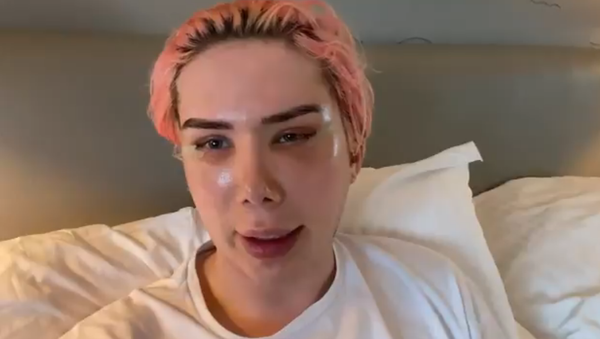 Screenshot from a video by a non-binary UK influencer, Oli London, who identifies as 'Korean' and shares their 'transition story' after undergoing plastic surgery aimed to make them look like a K-pop idol - Sputnik International