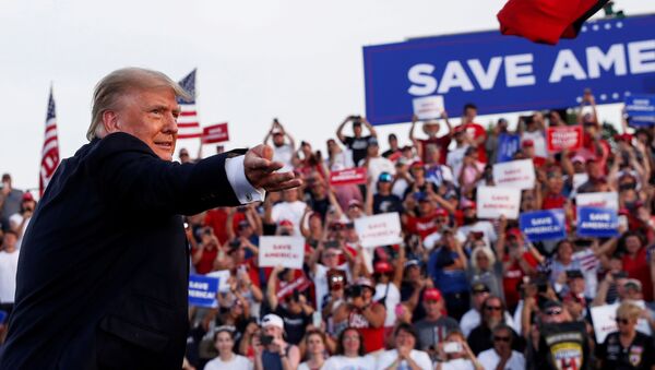 Former U.S. President Donald Trump tosses out a hat during his first post-presidency campaign rally at the Lorain County Fairgrounds in Wellington, Ohio, U.S., June 26, 2021 - Sputnik International