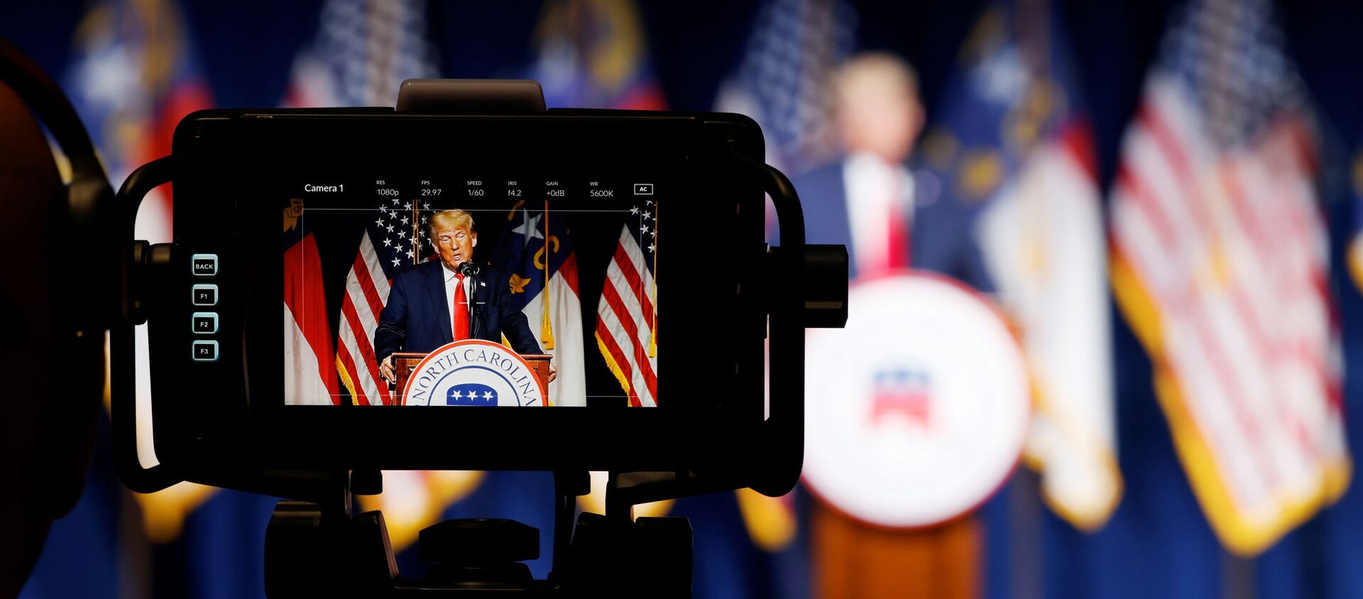 Former U.S. President Donald Trump is seen in a live television monitor as he speaks at the North Carolina GOP convention dinner in Greenville, North Carolina, U.S. June 5, 2021 - Sputnik International, 1920, 29.06.2021