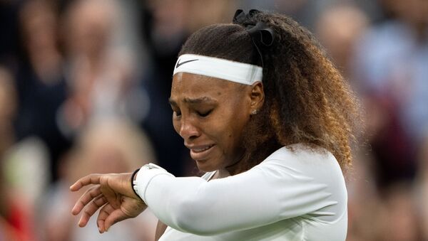 Tennis - Wimbledon - All England Lawn Tennis and Croquet Club, London, Britain - June 29, 2021 Serena Williams of the U.S. reacts after sustaining an injury before retiring from her first round match against Belarus' Aliaksandra Sasnovich - Sputnik International