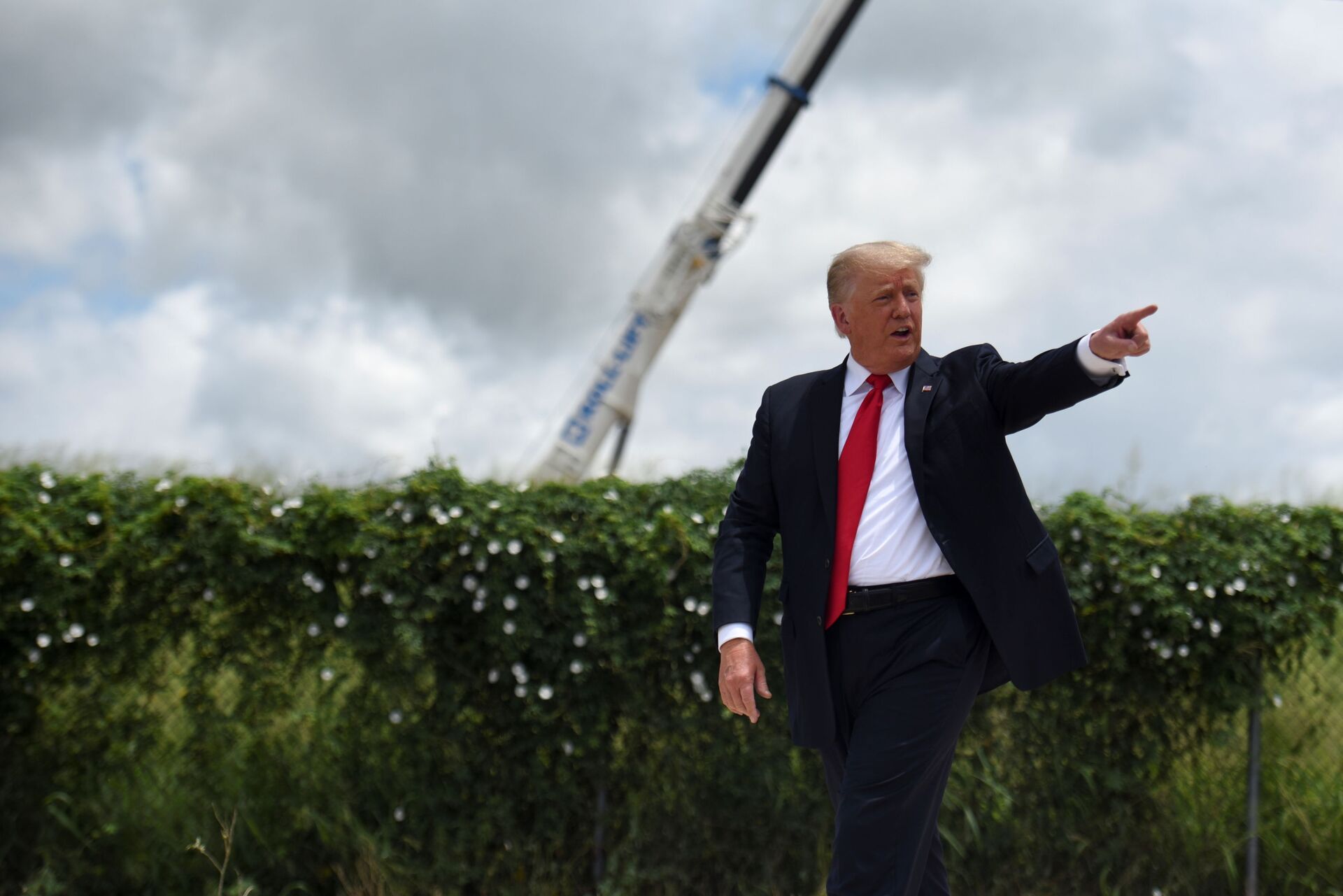 Former U.S. President Donald Trump exits the stage after visiting an unfinished section of the wall along the U.S.-Mexico border with Texas Governor Greg Abbott in Pharr, Texas, U.S. June 30, 2021.  - Sputnik International, 1920, 07.09.2021