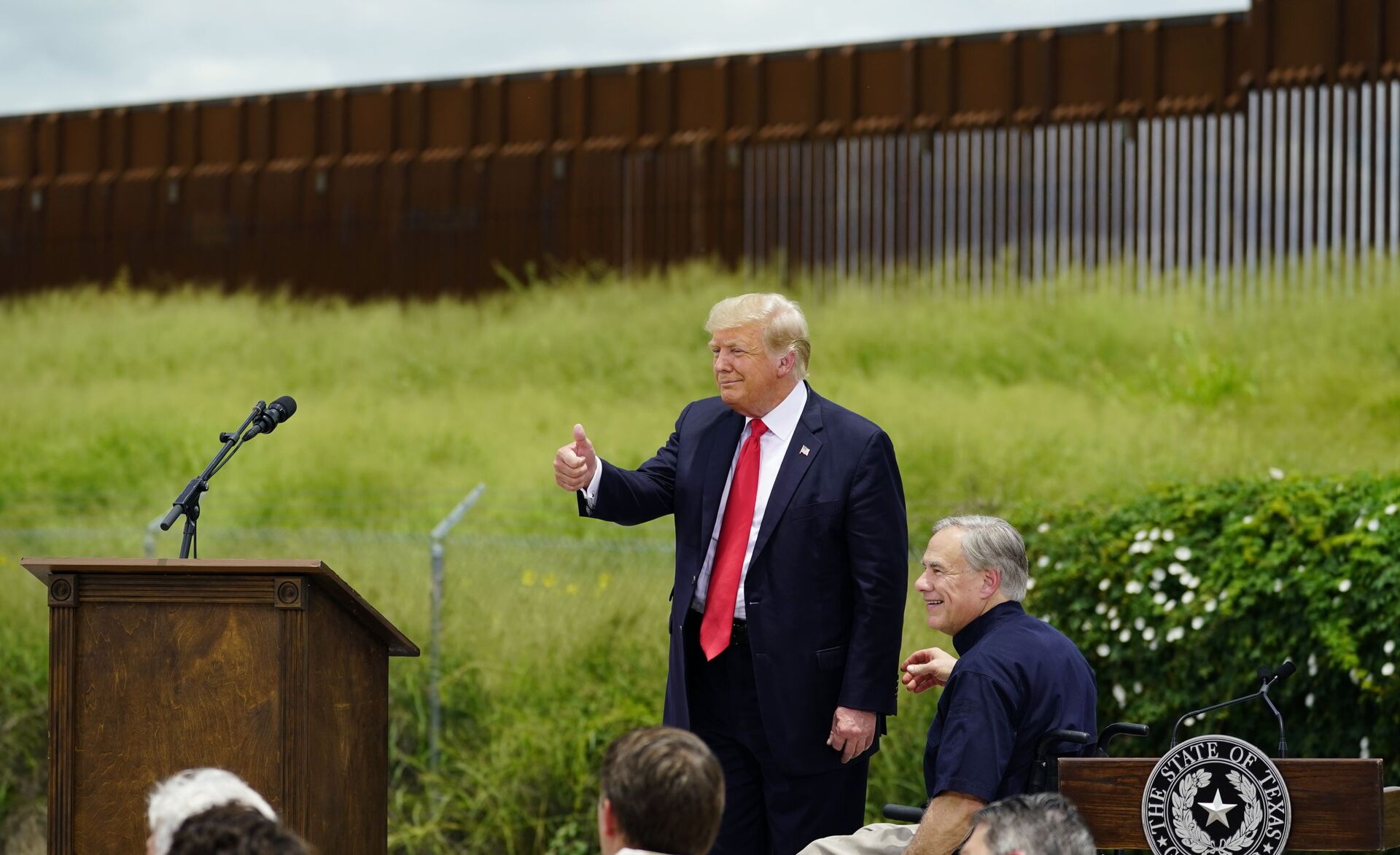 Former President Donald Trump, left, and Texas Gov. Greg Abbott, right, visit an unfinished section of border wall, in Pharr, Texas, Wednesday, June 30, 2021 - Sputnik International, 1920, 07.09.2021