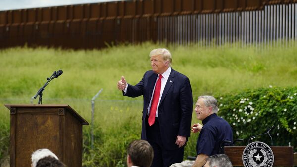 Former President Donald Trump, left, and Texas Gov. Greg Abbott, right, visit an unfinished section of border wall, in Pharr, Texas, Wednesday, 30 June 2021 - Sputnik International