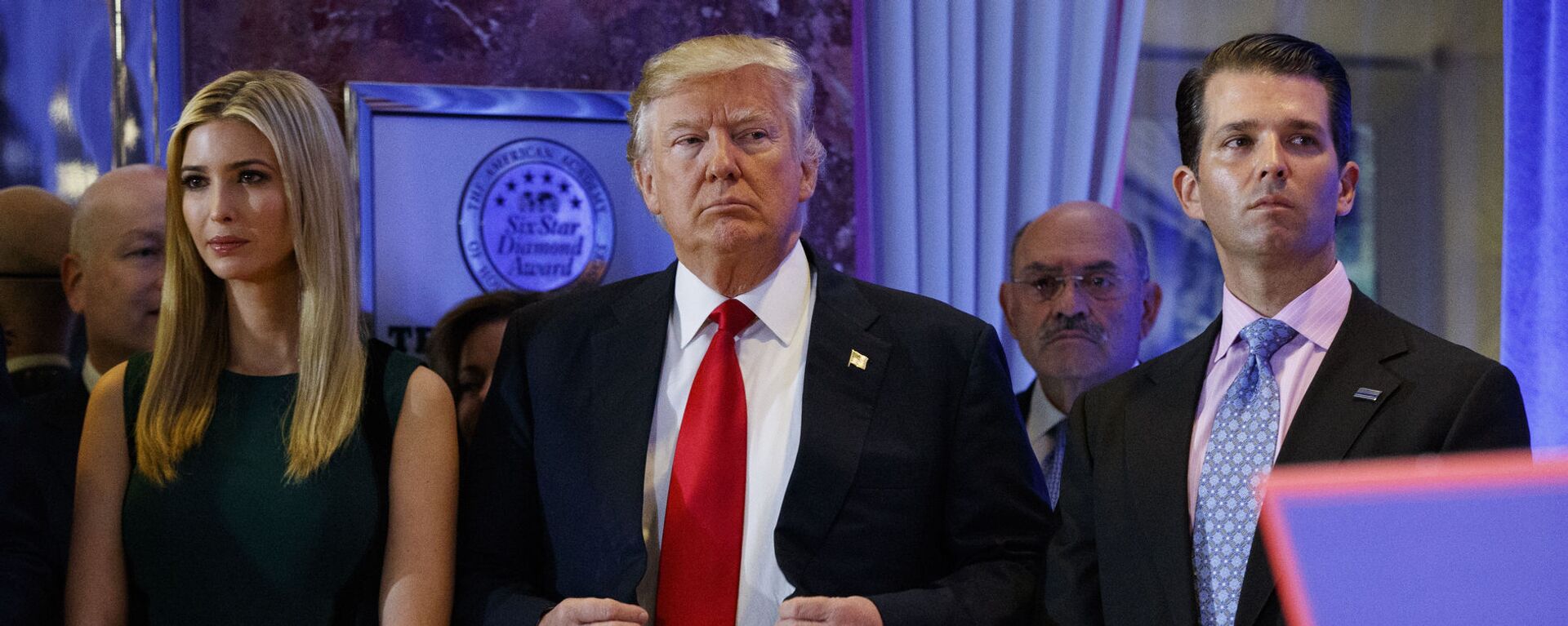 In this 11 January 2017, photo, President-elect Donald Trump, centre, stands next to Allen Weisselberg, second from left, Donald Trump Jr., right and Ivanka Trump, left, at a news conference in the lobby of Trump Tower in New York - Sputnik International, 1920, 01.07.2021