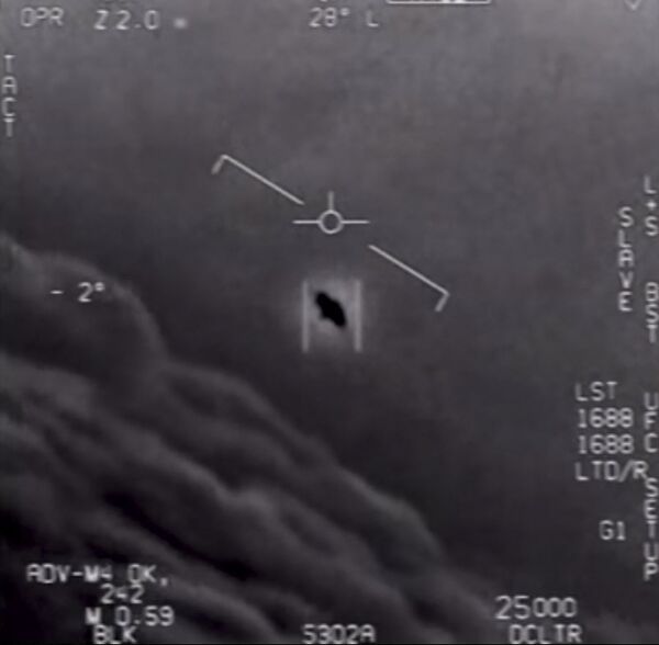 In this file video grab image, obtained on 26 April 2020, you can see  part of an unclassified video taken by Navy pilots showing a UFO.  - Sputnik International