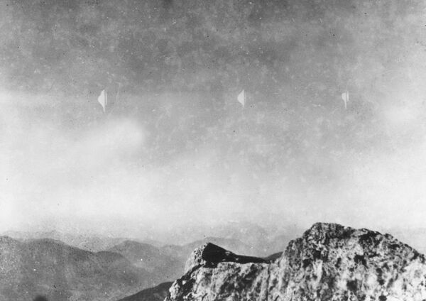 This photograph, reproduced from the quarterly UFO periodical Flying Saucers International in Los Angeles, shows silvery white flying objects photographed by Erich Kaiser while descending from Reichenstein mountain in Austria on 3 August 1954.  - Sputnik International