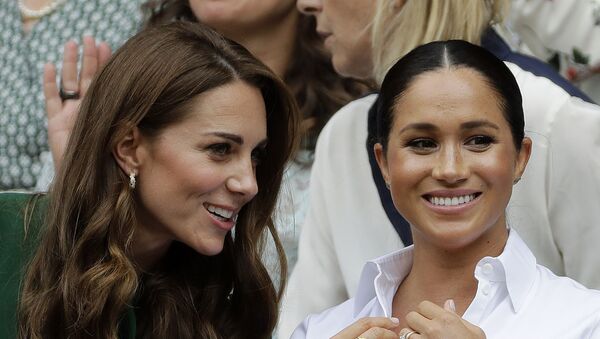 In this Saturday, July 13, 2019, file photo, Kate, Duchess of Cambridge, left, and Meghan, Duchess of Sussex chat as they sit in the Royal Box on Centre Court to watch the women's singles final match between Serena Williams of the United States and Romania's Simona Halep on day twelve of the Wimbledon Tennis Championships in London - Sputnik International