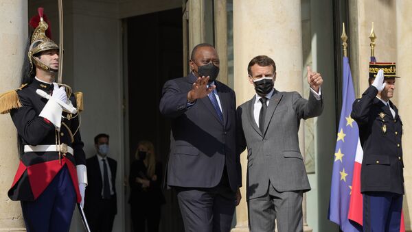French President Emmanuel Macron waves with Kenyan President Uhuru Kenyatta before their talks Thursday, July 1, 2021 in Paris. - Sputnik International