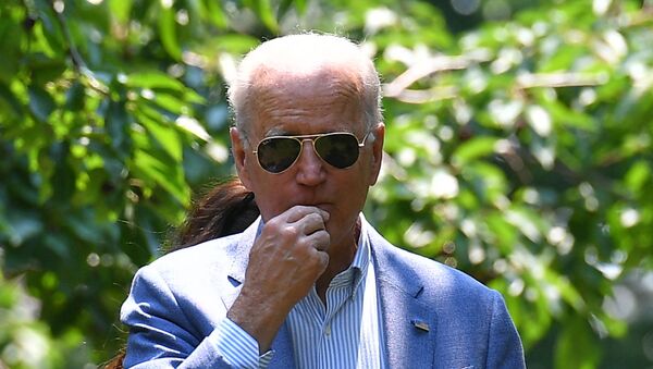 US President Joe Biden tries a cherry as he tours King Orchards, a fruit farm in Central Lake, Michigan on July 3, 2021. - Sputnik International