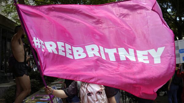 A Britney Spears supporter waves a Free Britney flag outside a court hearing concerning the pop singer's conservatorship at the Stanley Mosk Courthouse, Wednesday, June 23, 2021, in Los Angeles - Sputnik International
