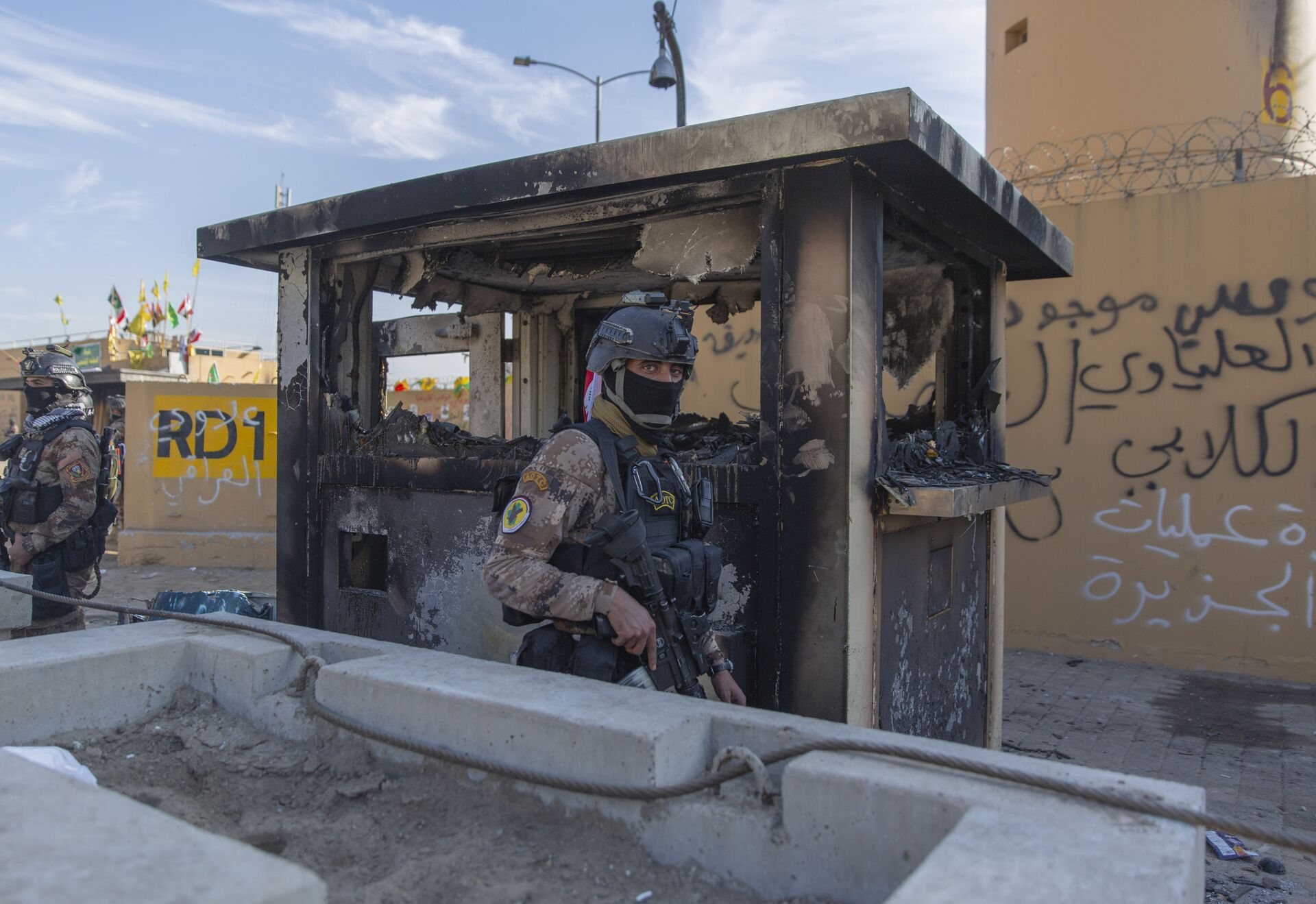 In this Jan. 1, 2020 file photo, Iraqi army soldiers are deployed in front of the U.S. embassy, in Baghdad, Iraq.  U.S. and Iraqi officials on Thursday, Dec. 3, say the U.S. is withdrawing some staff from its embassy in Baghdad, temporarily reducing personnel amid regional security concerns. - Sputnik International, 1920, 07.09.2021