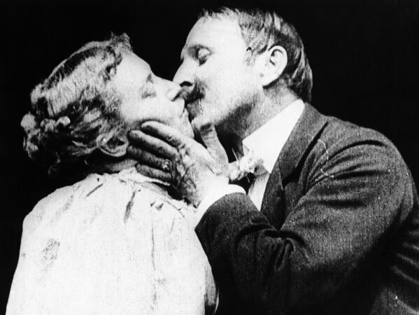 This rare photo shows the first kiss shown in the movies. It is a scene from Thomas Edison's film The Kiss featuring May Irwin and John C. Rice. It scandalised audiences back in 1896. - Sputnik International