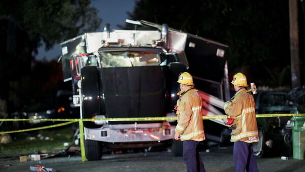 A damaged vehicle is seen at the site of an explosion after police attempted to safely detonate illegal fireworks that were seized, in Los Angeles, California, U.S., June 30, 2021 - Sputnik International