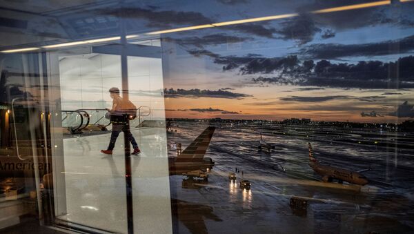 A passenger arrives at terminal D of Miami International Airport after heavy rains, as Hurricane Elsa moves towards south Florida, in Miami, U.S. July 2, 2021. - Sputnik International