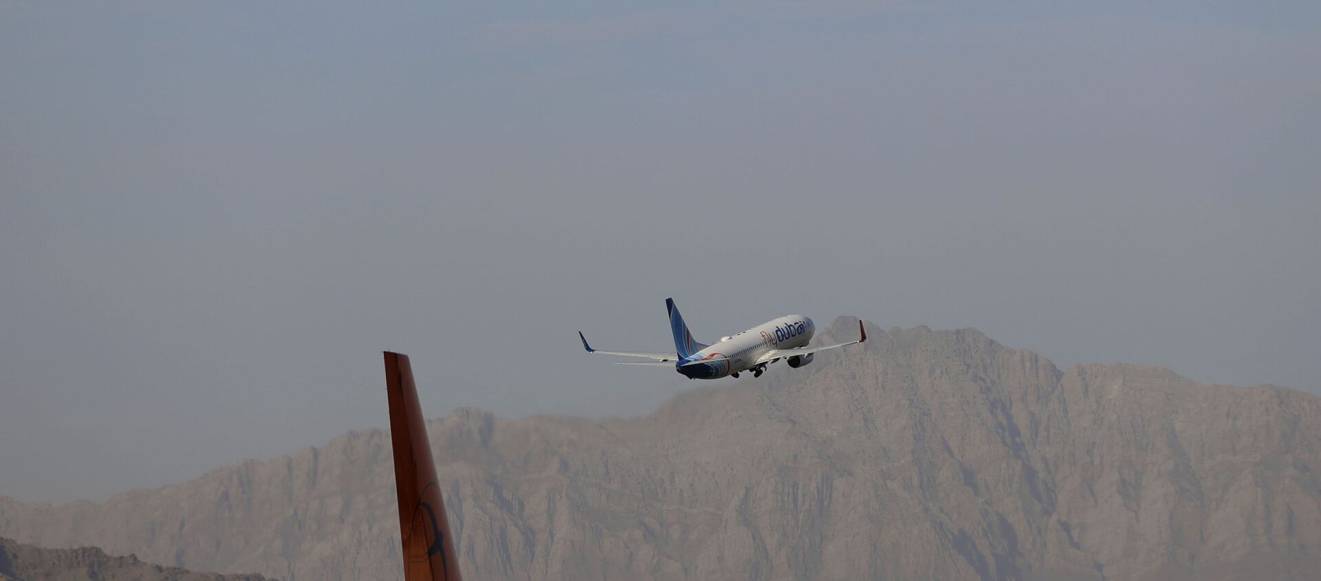 A fly Dubai plane departs Hamid Karzai International Airport in Kabul, Afghanistan, Sunday, July 4, 2021. - Sputnik International, 1920, 14.07.2021