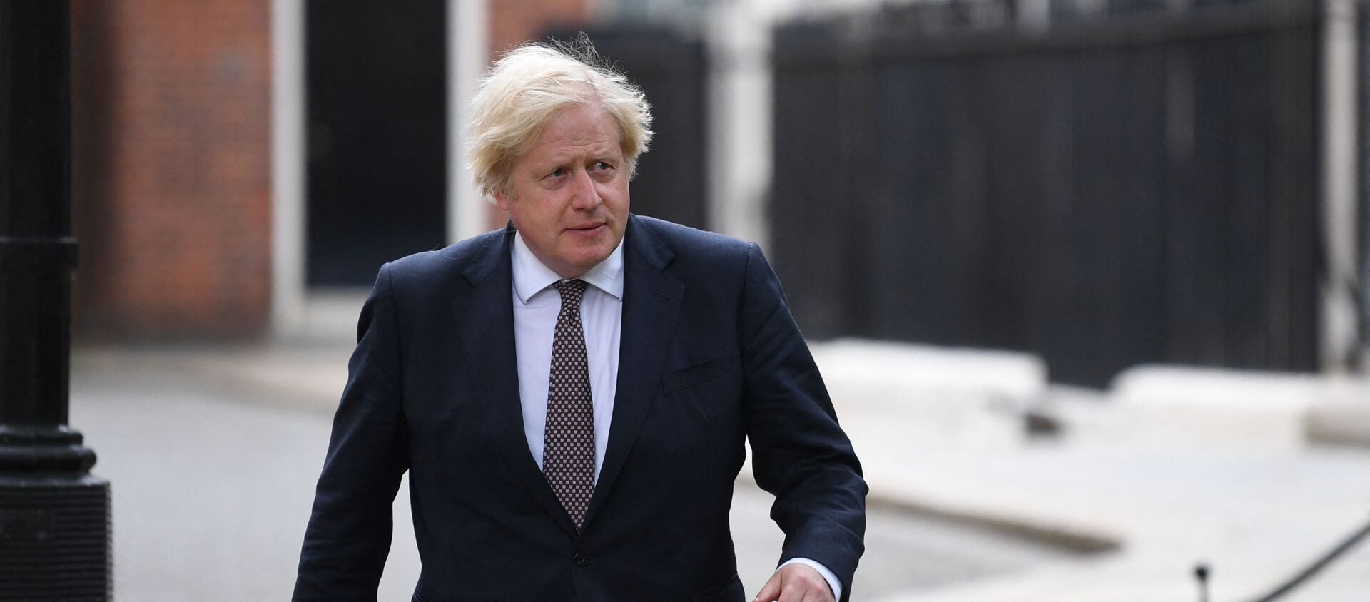 Britain's Prime Minister Boris Johnson on his way to giving an update on relaxing restrictions imposed on the country during the coronavirus covid-19 pandemic at a virtual press conference inside the Downing Street Briefing Room in central London on July 5, 2021. - Prime Minister Boris Johnson will on Monday unveil a plan to lift most if not all of England's pandemic restrictions from July 19, as he urged the public to learn to live with the coronavirus - Sputnik International, 1920, 12.07.2021