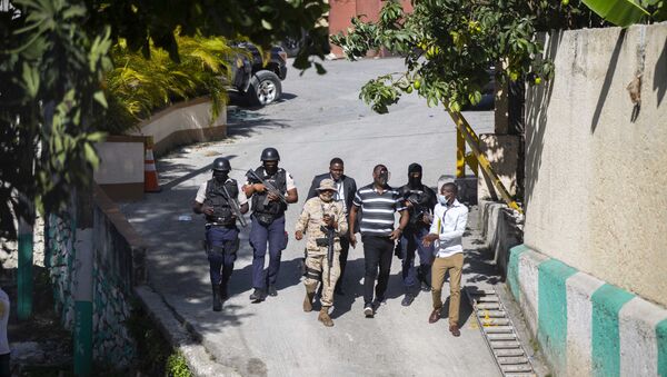 Security forces investigate the perimeters of the residence of Haitian President Jovenel Moise, in Port-au-Prince, Haiti, Wednesday, July 7, 2021. - Sputnik International