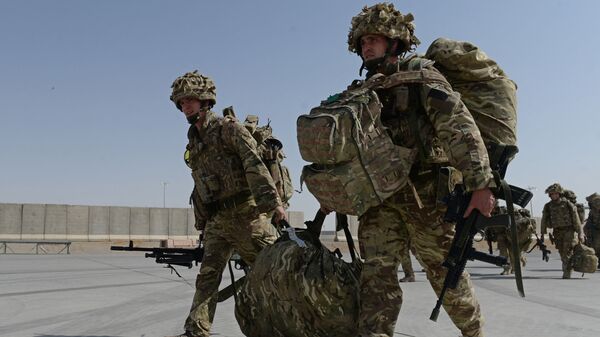 British soldiers walk with their gear after arriving in Kandahar on October 27, 2014, as British and US forces withdraw from the Camp Bastion-Leatherneck complex in Helmand province - Sputnik International
