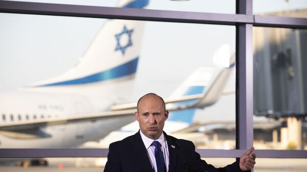 In this June 22, 2021 file photo, Israel's Prime Minister Naftali Bennett speaks to journalists after touring Ben Gurion Airport, with the Minister of Health Nitzan Horowitz and the Minister of Transportation Merav Michaeli. - Sputnik International
