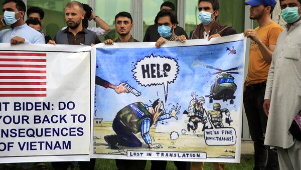 In this Friday, April 30, 2021, file photo former Afghan interpreters hold banners during a protest against the U.S. government and NATO in Kabul, Afghanistan. - Sputnik International