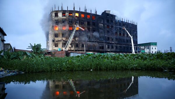 Flames rise the morning after a fire broke out at a factory named Hashem Foods Ltd. in Rupganj of Narayanganj district, on the outskirts of Dhaka, Bangladesh, July 9, 2021 - Sputnik International