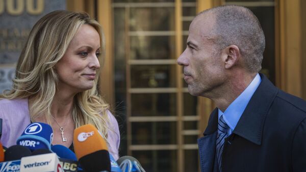 In this April 16, 2018, file photo, adult film actress Stormy Daniels, left, stands with her then lawyer, Michael Avenatti, during a press conference outside federal court in New York. A trial for Avenatti to face charges that he cheated ex-client Daniels out of proceeds from her book was delayed Friday, Jan. 8, 2021, until next year - Sputnik International