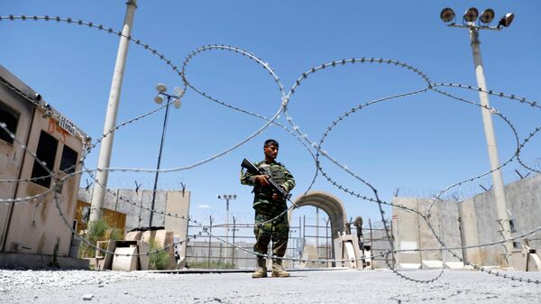 An Afghan National Army soldier stands guard at the gate of Bagram U.S. air base, on the day the last of American troops vacated it, Parwan province, Afghanistan July 2, 2021. - Sputnik International
