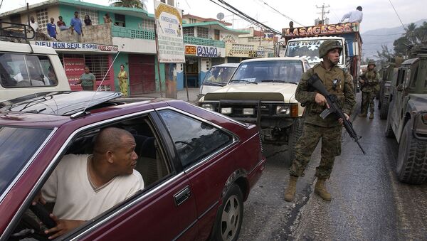 U.S. Marines from the 3rd Battalion, 8th Marine Regiment, Camp Lejeune, N.C., patrol the streets of Port-au-Prince, Haiti, on March 9, 2004. U.S. troops are deployed to Haiti at the request of the new Haitian President to help promote the constitutional political process, to prepare for the arrival of a U.N. multinational force, facilitate humanitarian assistance, and secure key sites in the capital of Port-au-Prince. - Sputnik International
