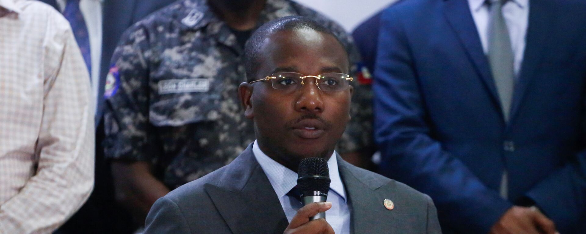 Haiti's interim Prime Minister Claude Joseph addresses the audience after suspects in the assassination of President Jovenel Moise, who was shot dead early Wednesday at his home, were shown to the media, in Port-au-Prince, Haiti, 8 July 2021.  - Sputnik International, 1920, 11.07.2021