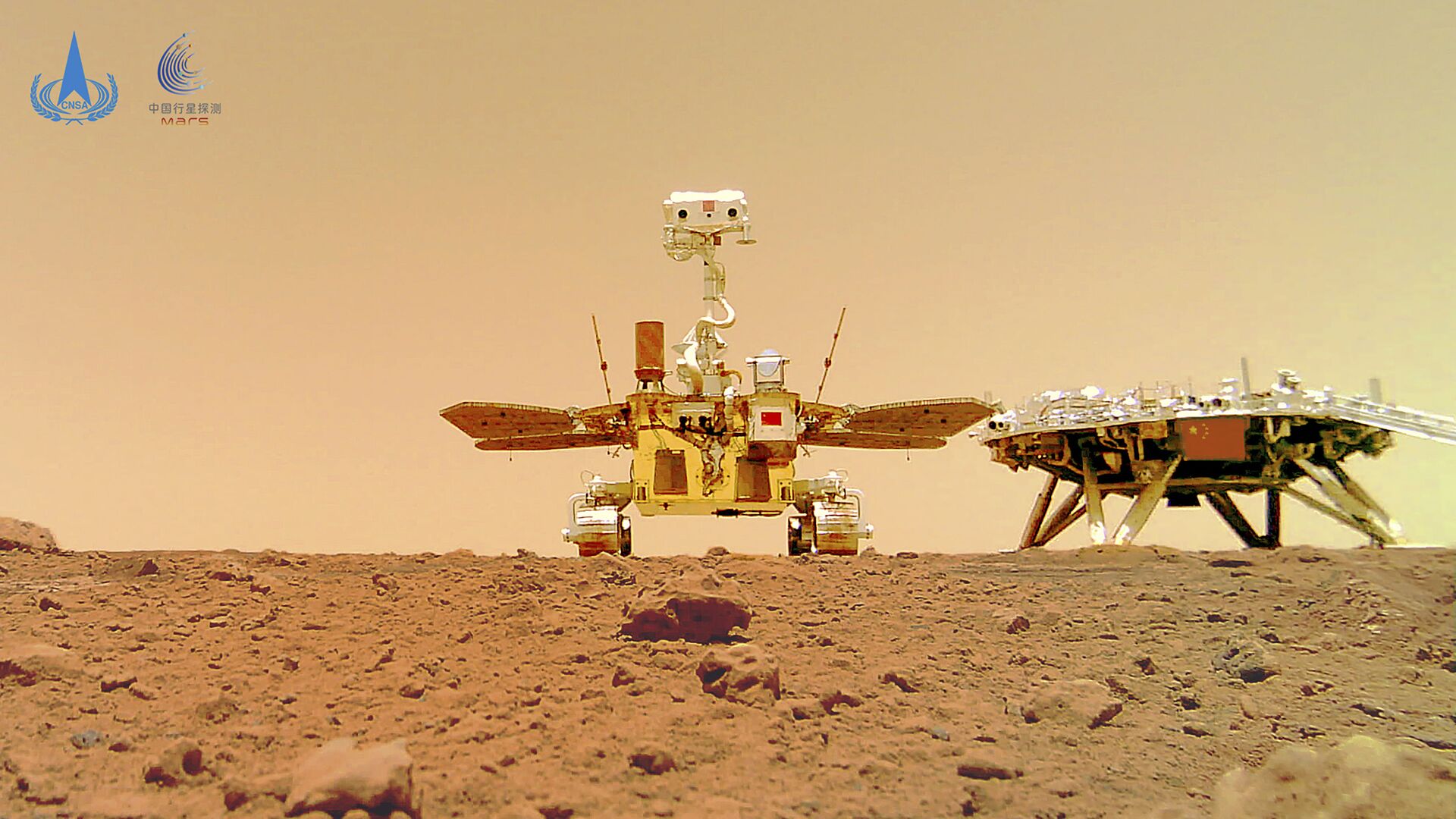 In this image released by the China National Space Administration (CNSA) on Friday, June 11, 2021, the Chinese Mars rover Zhurong is seen near its landing platform taken by a remote camera that was dropped into position by the rover. - Sputnik International, 1920, 29.01.2022