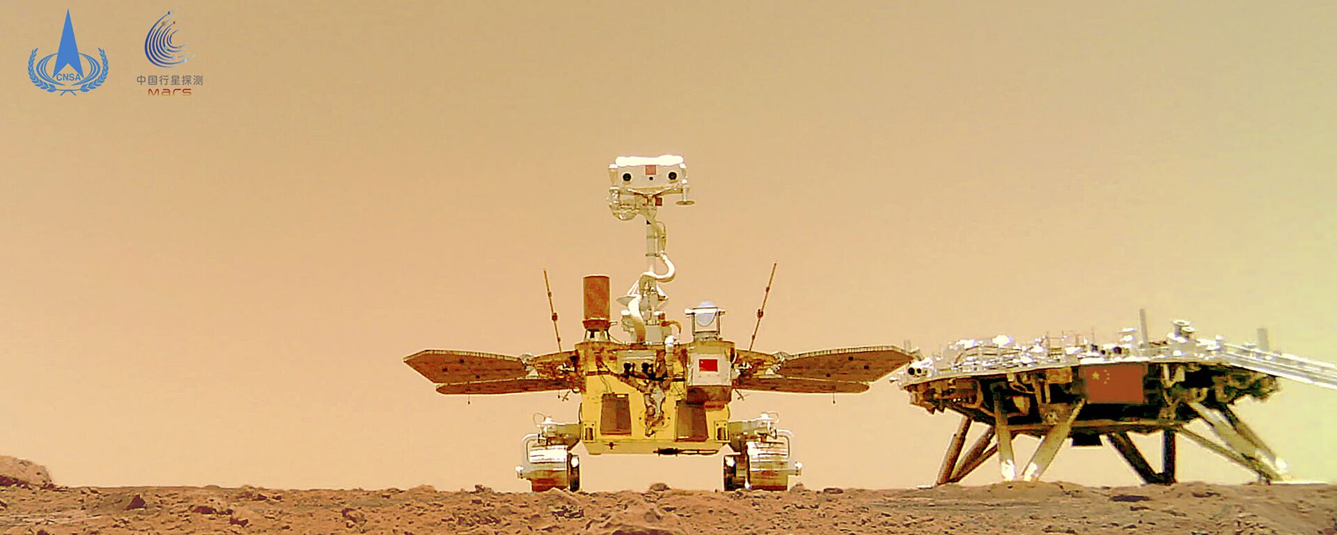 In this image released by the China National Space Administration (CNSA) on Friday, June 11, 2021, the Chinese Mars rover Zhurong is seen near its landing platform taken by a remote camera that was dropped into position by the rover. - Sputnik International, 1920, 29.01.2022