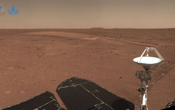 This handout photograph taken on July 4, 2021 and released on July 9, 2021 by the China National Space Administration (CNSA) shows the surface of Mars taken from China's Zhurong Mars rover. (Photo by HANDOUT / China National Space Administration (CNSA) / AFP) / -----EDITORS NOTE --- RESTRICTED TO EDITORIAL USE - MANDATORY CREDIT AFP PHOTO / CNSA - NO MARKETING - NO ADVERTISING CAMPAIGNS - DISTRIBUTED AS A SERVICE TO CLIENTS - Sputnik International