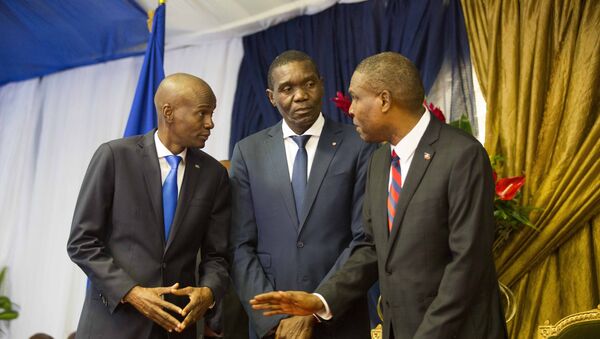 In this Aug. 7, 2018 file photo, Haiti's newly-named Prime Minister Jean-Henry Ceant, right, talks to Haiti's President Jovenel Moise, left, and Senate President Joseph Lambert, during his appointment ceremony at the national Palace in Port-au-Prince, Haiti. - Sputnik International