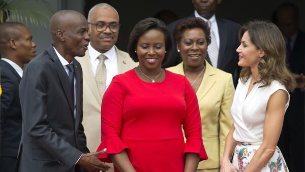In this May 23, 2018, file photo, Haiti's President Jovenel Moise, left, and First Lady Martine Moise, in red, receive Spain's Queen Letizia Ortiz at the national Palace in Port-au-Prince, Haiti, Wednesday, May 23, 2018. - Sputnik International
