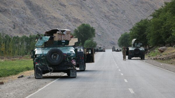 Afghan soldiers pause on a road at the front line of fighting between Taliban and Security forces,  near the city of Badakhshan, northern Afghanistan, Sunday, July. 4, 2021. - Sputnik International