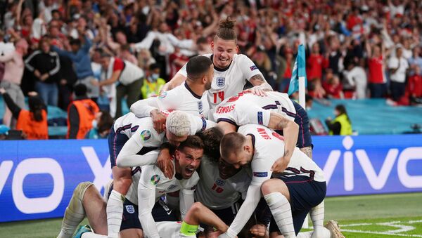 Soccer Football - Euro 2020 - Semi Final - England v Denmark - Wembley Stadium, London, Britain - 7 July 2021 England's Harry Kane celebrates scores their second goal with teammates  - Sputnik International
