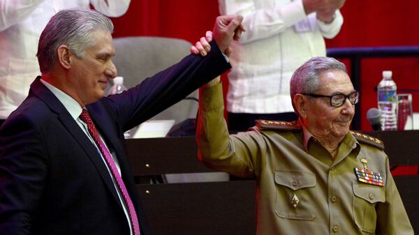 Raul Castro, right, raises the hand of Cuban President Miguel Diaz-Canel after Diaz-Canel was elected First Secretary of the Communist Party at the closing session of Cuban Communist Party's  8th Congress at the Convention Palace in Havana, Cuba, Monday, April 19, 2021. - Sputnik International