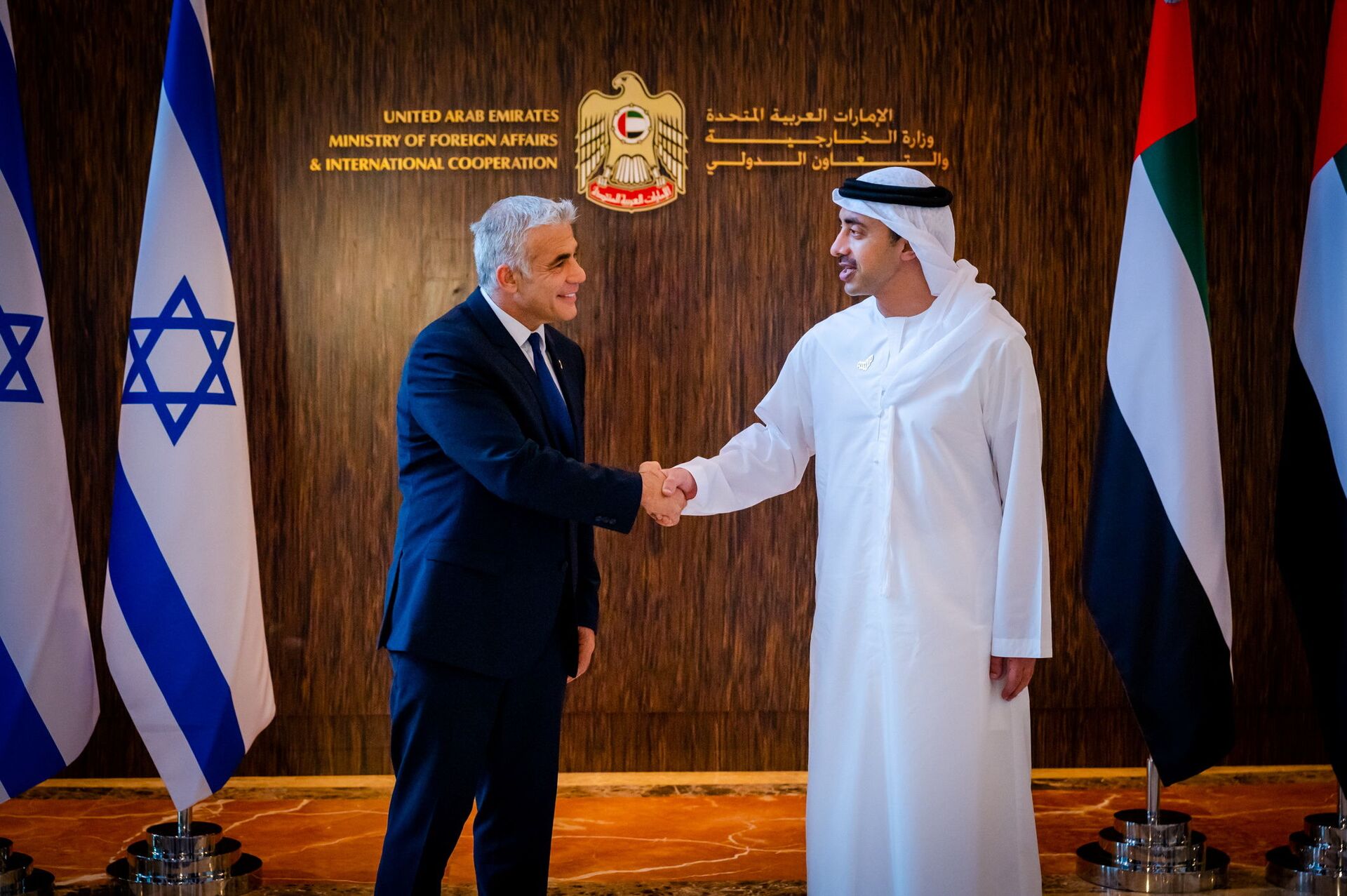 Israel's Foreign Minister Yair Lapid shakes hands with United Arab Emirates' Foreign Minister Sheikh Abdullah bin Zayed al-Nahyan in Abu Dhabi, UAE June 29, 2021. - Sputnik International, 1920, 12.12.2021