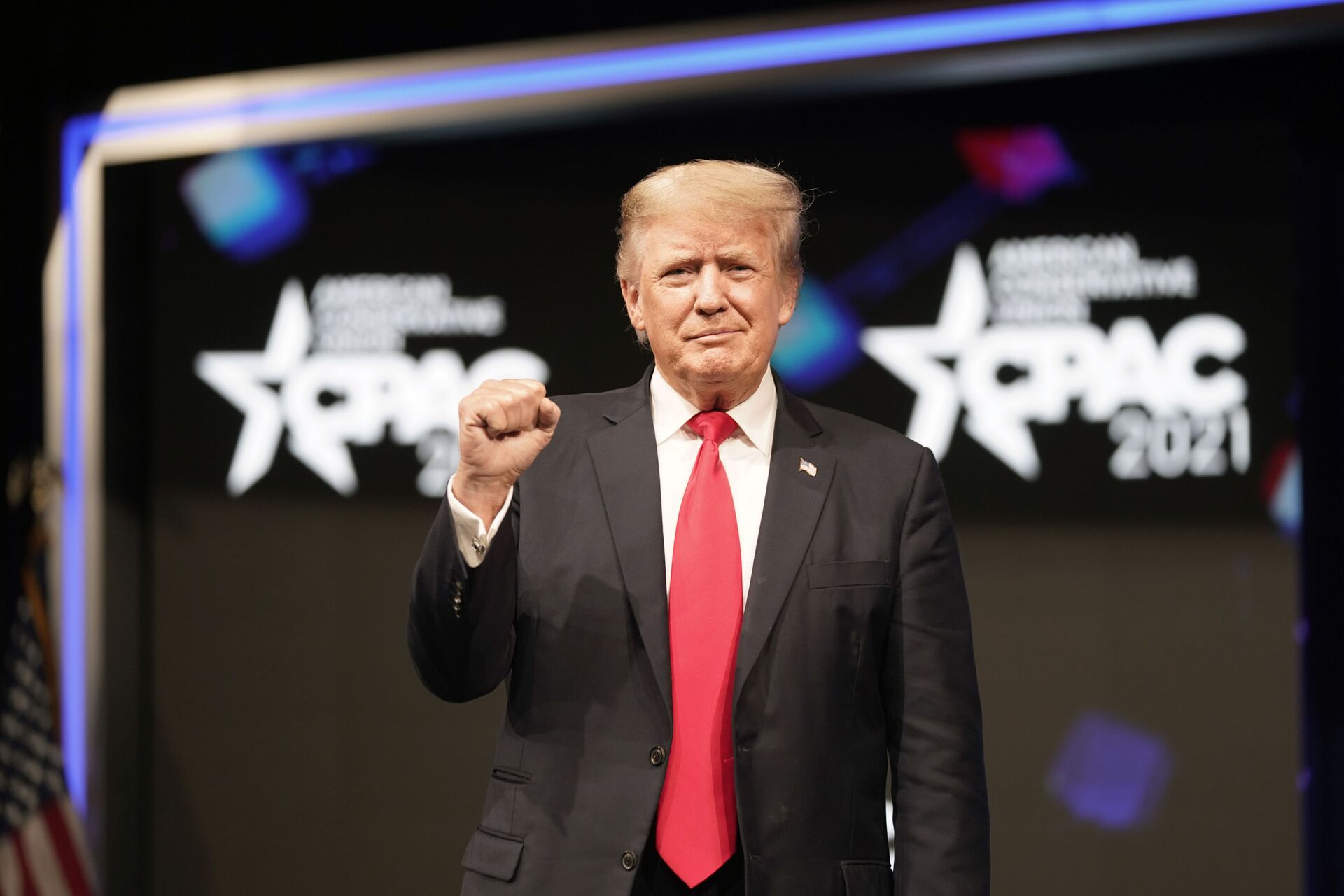 Former president Donald Trump raises his fist before speaking at the Conservative Political Action Conference (CPAC) Sunday, July 11, 2021, in Dallas.  - Sputnik International, 1920, 07.09.2021