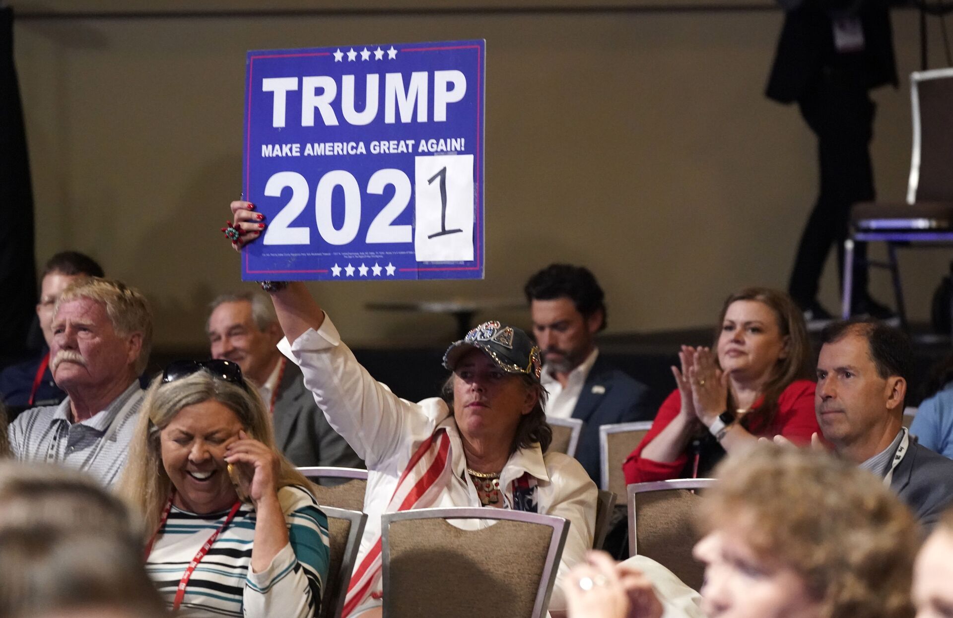 A conservative supporter holds up a sign during the opening general session of the Conservative Political Action Conference (CPAC) Friday, July 9, 2021, in Dallas. - Sputnik International, 1920, 07.09.2021