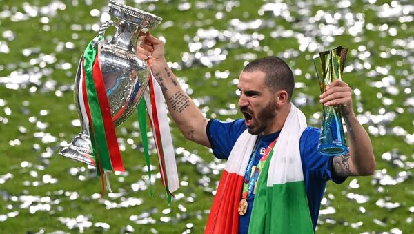 Soccer Football - Euro 2020 - Final - Italy v England - Wembley Stadium, London, Britain - July 11, 2021 Italy's Leonardo Bonucci celebrates with the trophy after winning Euro 2020  - Sputnik International