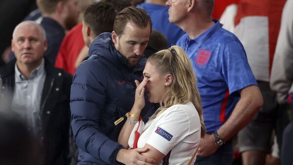 England's Harry Kane embraces his wife Kate at the end of the Euro 2020 soccer championship final match between England and Italy at Wembley stadium in London on Sunday 11 July 2021. - Sputnik International