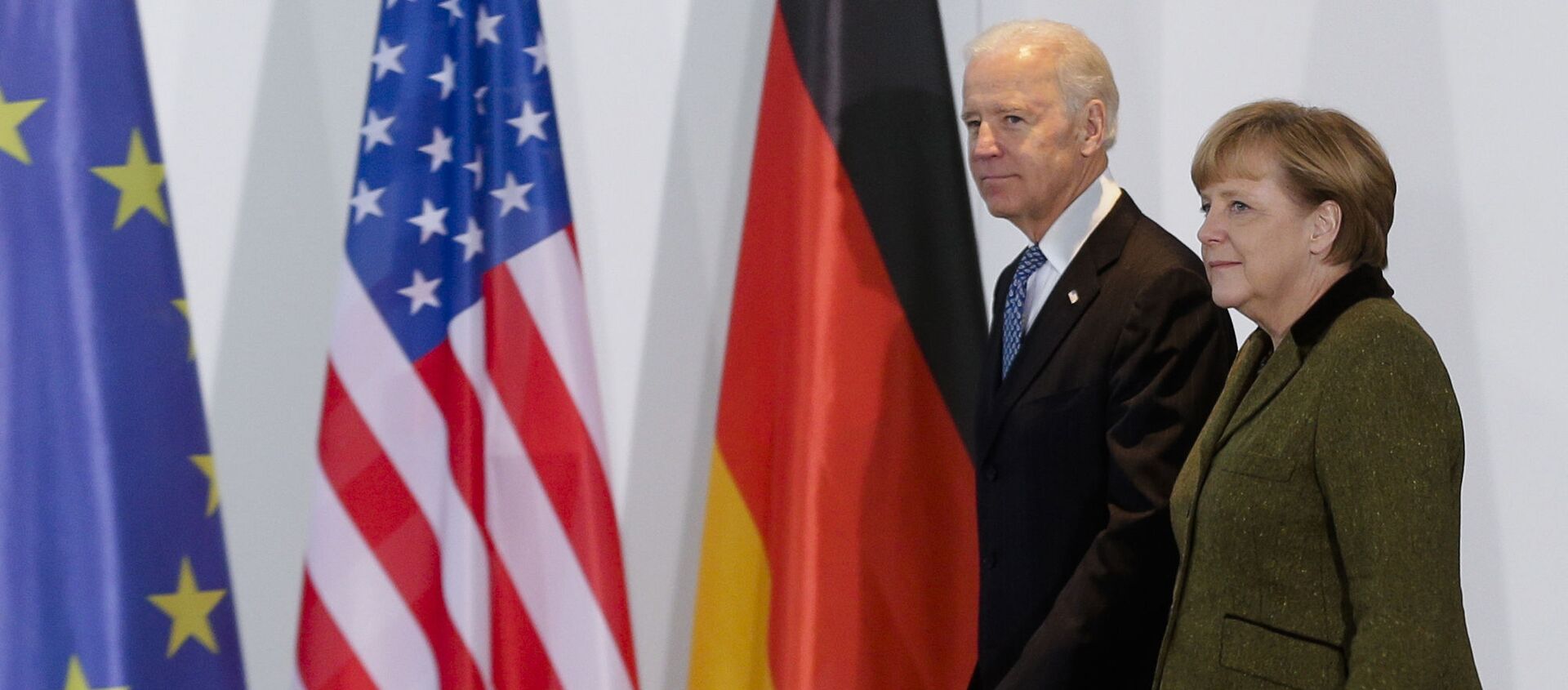 In this Feb. 1, 2013 file photo, German Chancellor Angela Merkel, right, and U.S. Vice President Joe Biden walk at the chancellery in Berlin, Germany. On Biden’s first foreign trip as president, he will find many of his hosts in Europe welcoming but wary after a tense four years between Europe and the U.S. under former President Donald Trump. (AP Photo/Markus Schreiber, File) - Sputnik International, 1920, 13.07.2021