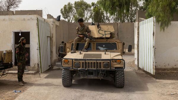 A member of Afghan Special Forces sits on the rooftop of his humvee as he arrives at the base after heavy clashes with Taliban during the rescue mission of a policeman besieged at a check post, in Kandahar province, Afghanistan, July 13, 2021. REUTERS/Danish Siddiqui - Sputnik International