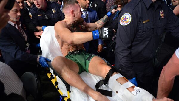 Jul 10, 2021; Las Vegas, Nevada, USA; Conor McGregor is carried off a stretcher following an injury suffered against Dustin Poirier during UFC 264 at T-Mobile Arena. - Sputnik International