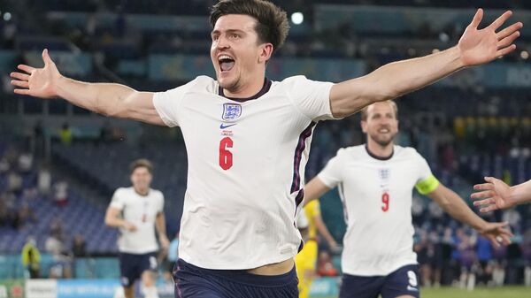 England's Harry Maguire celebrates after scoring his side's second goal during the Euro 2020 soccer championship quarterfinal match between Ukraine and England at the Olympic stadium in Rome at the Olympic stadium in Rome, Italy, Saturday, July 3, 2021 - Sputnik International
